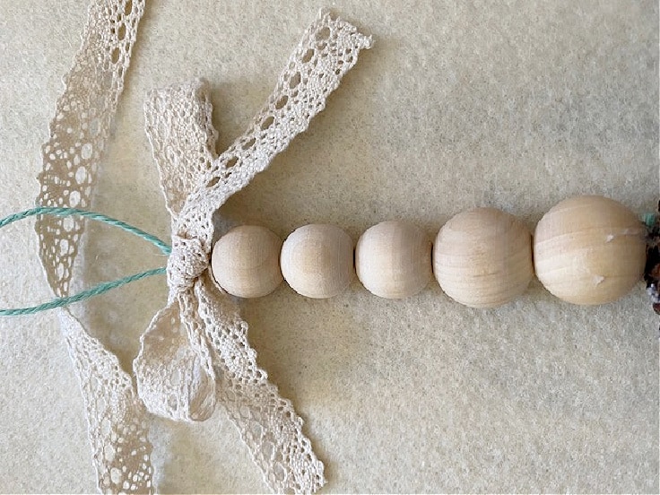 lace ribbon on wood bead ornament