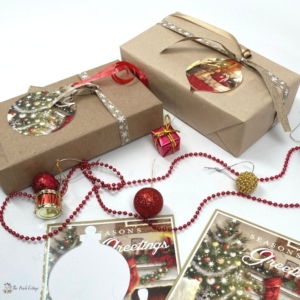 Gifts wrapped in brown paper with gift tags cut from recycled Christmas cards