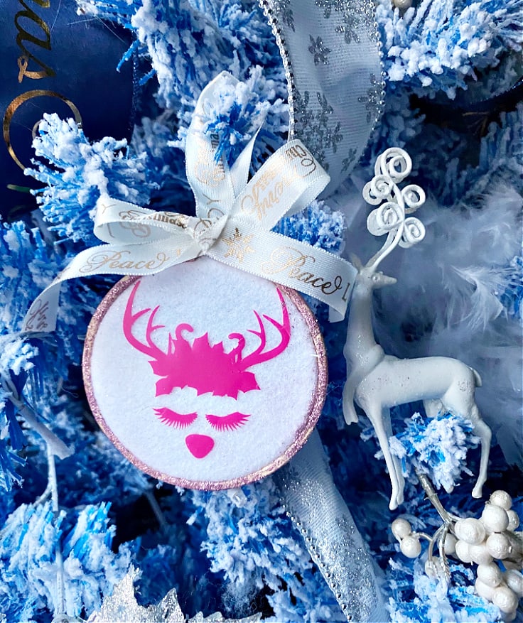 Reindeer embroidery hoop Christmas ornament on a tree