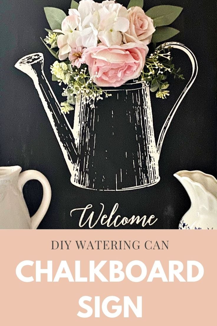 DIY watering can chalkboard sign embellished with pink silk flowers