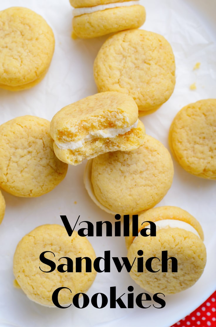 Golden sandwich cookies with white filling.