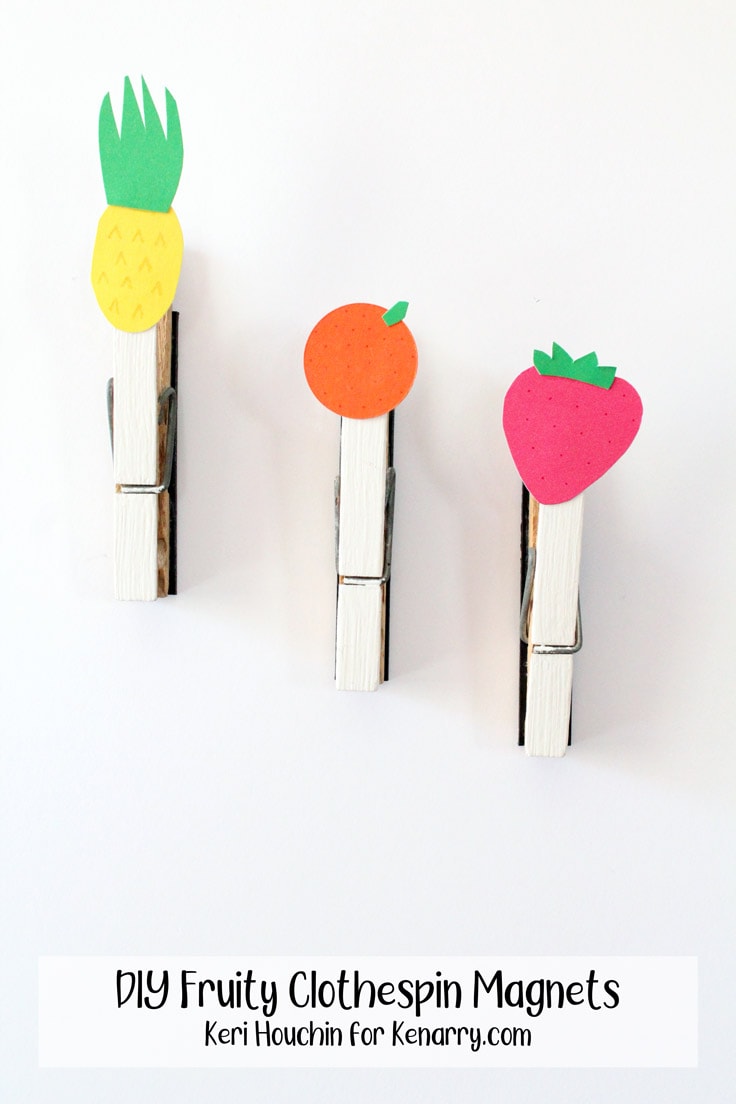 3 clothespin magnets decorated with paper pineapple, orange, and strawberry.