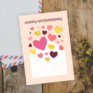 Preview of printable happy anniversary card with hearts coming out of envelope.