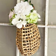 hanging floral rattan basket on window
