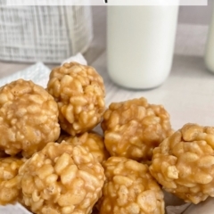 Stack of Peanut Butter Rice Krispies Bites with a glass jar of milk in the background.