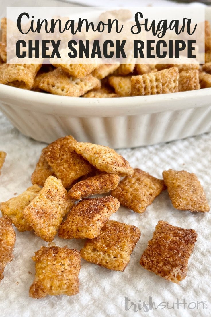 Cinnamon Sugar Chex Snack on a white napkin with a bowl of treats in the background.