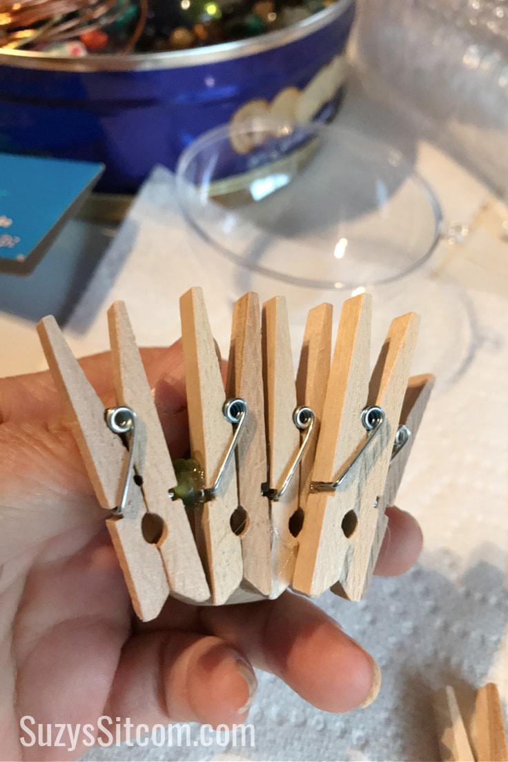 Wooden clothes pins that are glued together. 