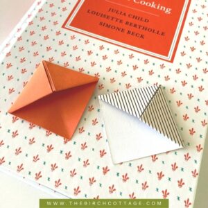 book with two origami corner bookmarks