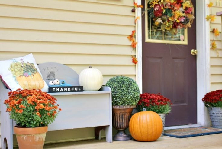 small front porch decorated for fall