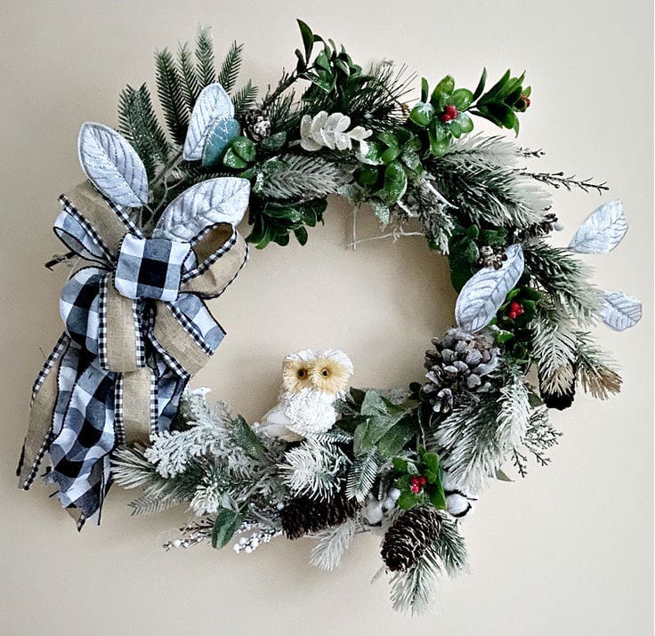 woodland winter wreath hanging on wall