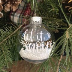round Christmas ornament with Let It Snow