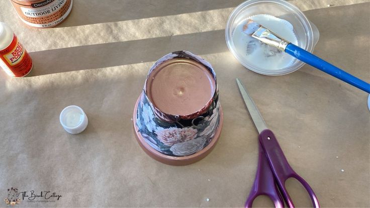 Using ModPodge to glue fabric to a terra cotta pot 