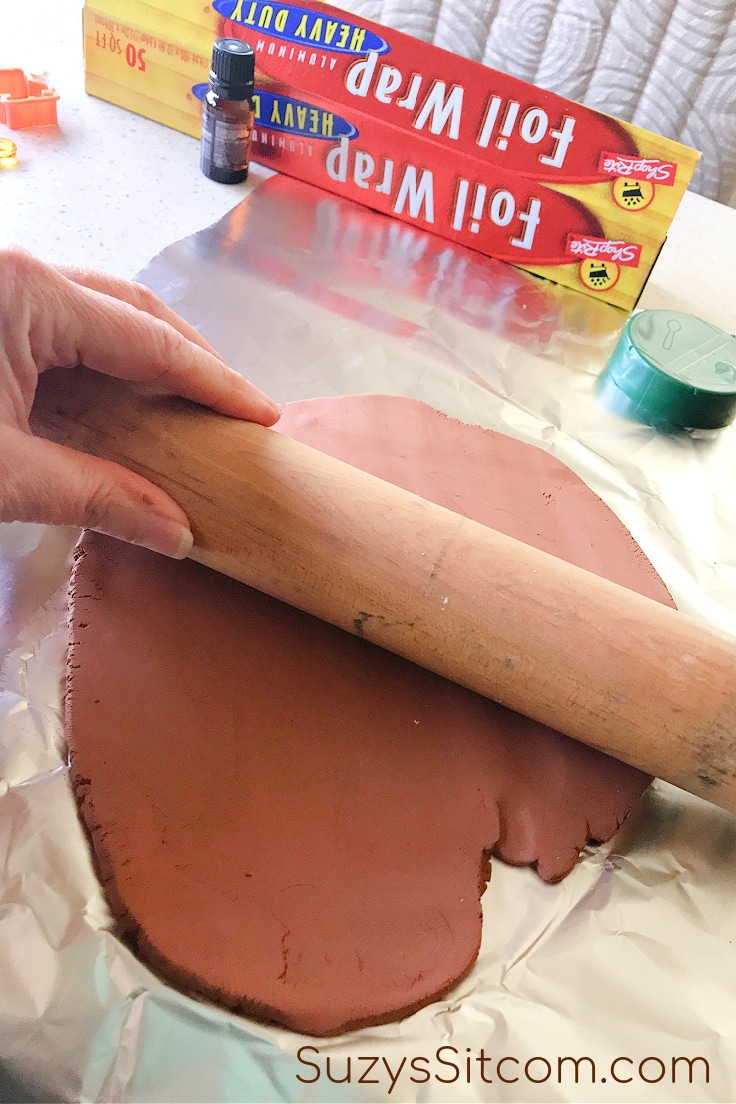 Using a rolling pin to prepare air-dry clay