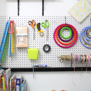 Organized craft room pegboard from One Mama's Daily Drama.