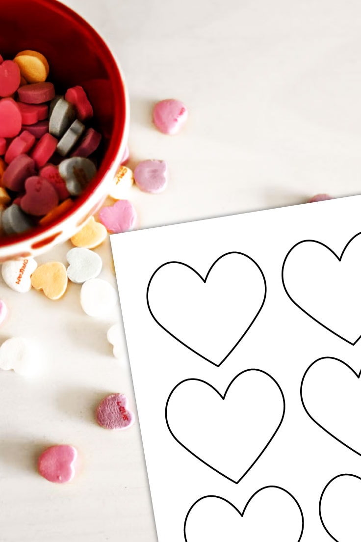 Preview of heart template page on top of white kitchen counter with bowl of conversation heart candies throughout.