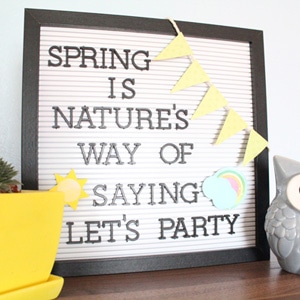Letter board with sun, rainbow, and banner accessories that reads 