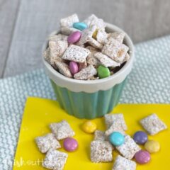 Dish filled with spring Chex mix treat.