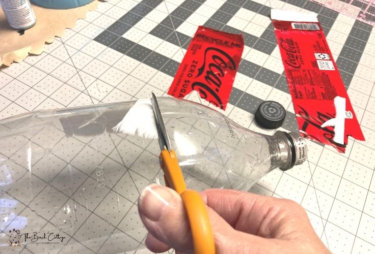 Cutting the top off a 2 liter plastic bottle