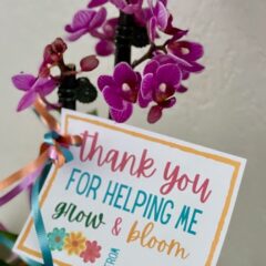 Thank You for Helping Me Grow & Bloom Notecard attached to a purple plant.