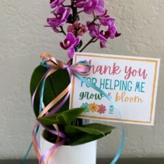 Thank You for Helping Me Grow & Bloom Notecard attached to a purple plant.