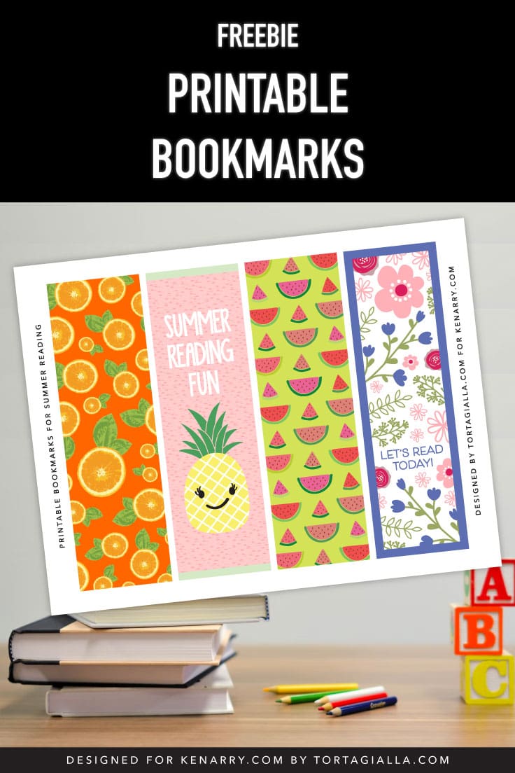 Preview of PDF of printable bookmarks with 4 designs included on top of photo books, colored pencils and kids ABC blocks in background.