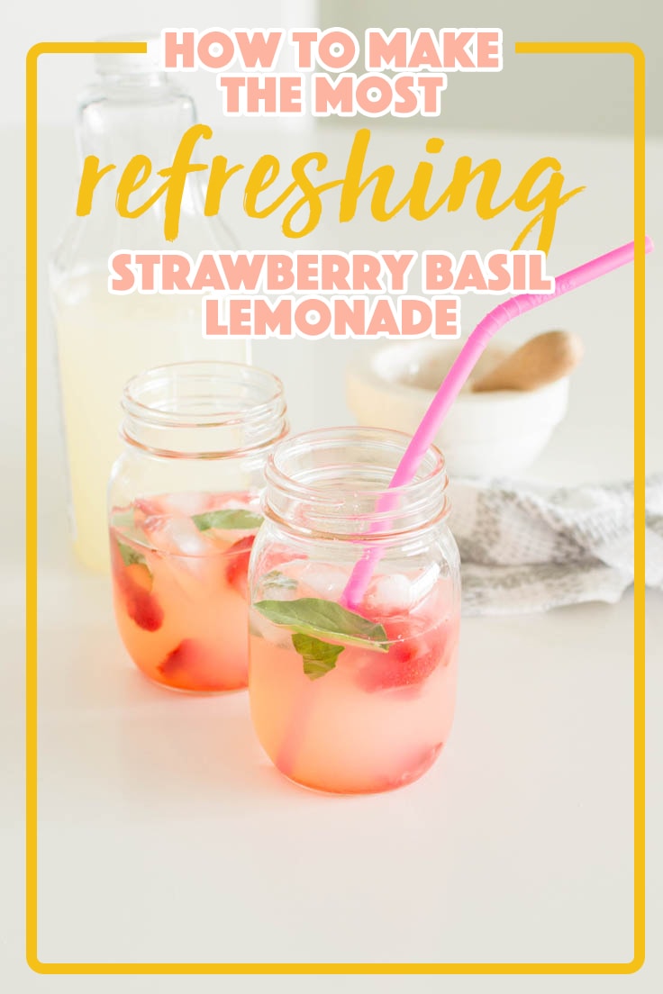 A mason jar filled with Strawberry Basil Lemonade and topped off with a pink straw