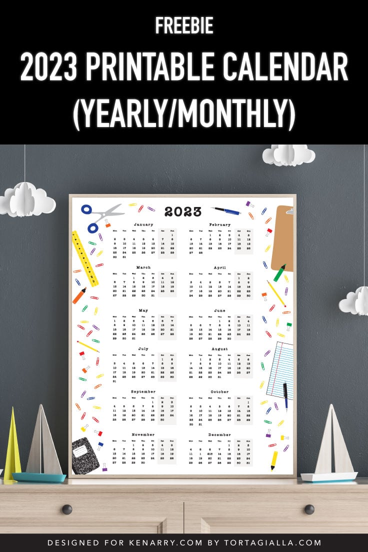 Preview of yearly calendar printable page in wooden frame on top of kids room dresser with handing cloud mobiles and sailboat decor around.