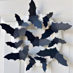paper bat wreath hanging on white door