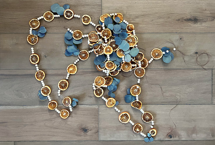 The completed orange and blue garland with dried orange slices 