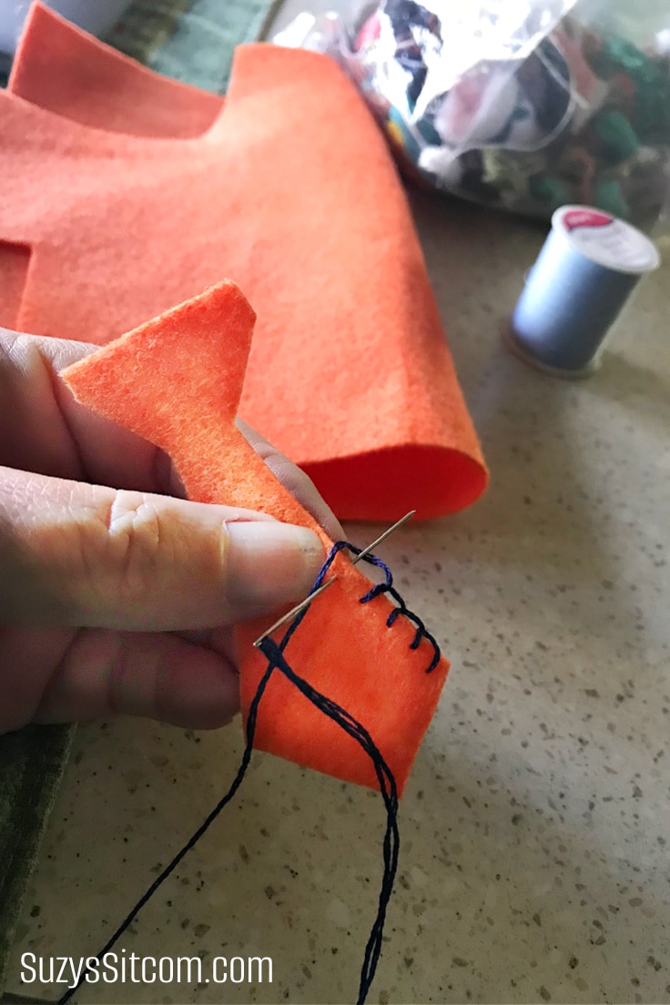 Creating a felt necktie for a handmade sock monkey.