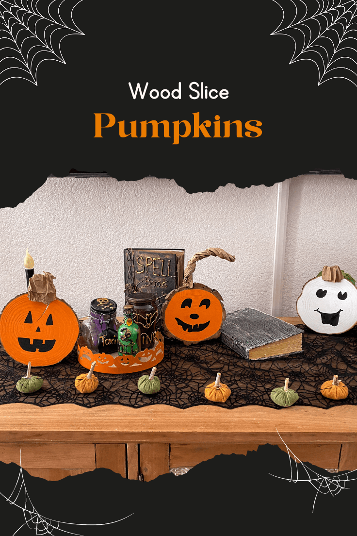 3 wood slice pumpkins sitting on a table with spell books and poison bottles.
