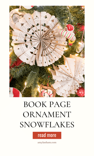 Book page snowflake ornaments in a tree