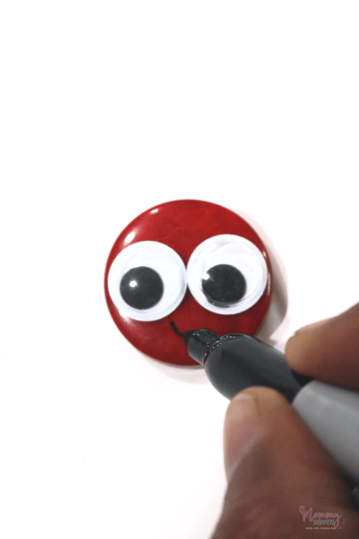 drawing a smile on a red button