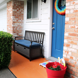 Rainbow front porch with orange concrete from One Mama's Daily Drama.