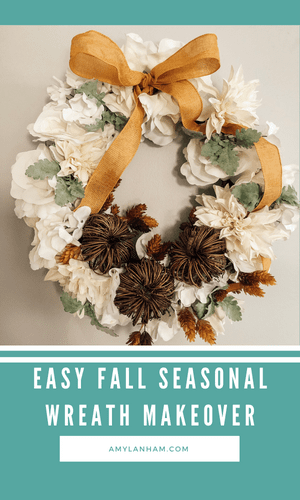 white wreath with twig pumpkins and gold ribbon
