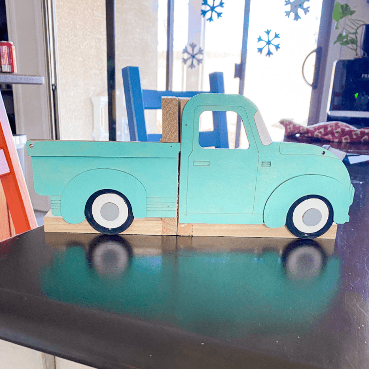 wood truck attached to bookends in the back