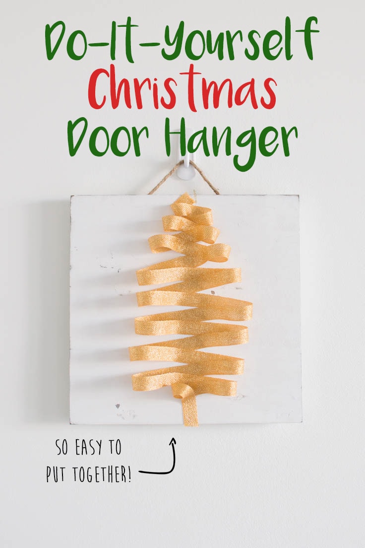 A simple DIY Christmas Door Hanger hanging on a white background