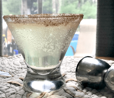 pear martini on table with shot glass