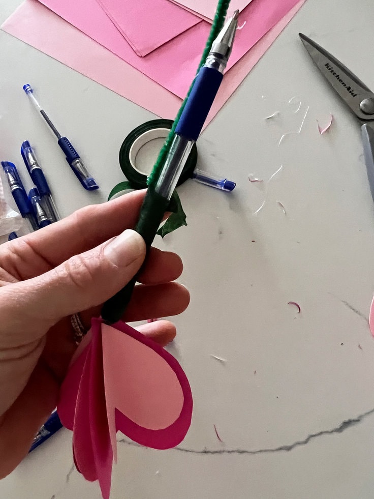 Floral tape secures the pipe cleaner to the pen and hides it.
