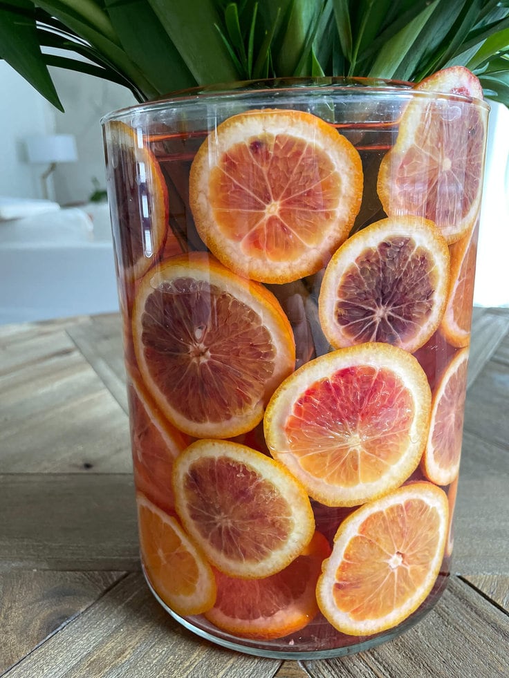 Blood oranges in vase for Spring Arrangement.