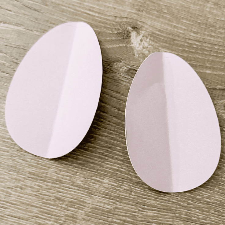 2 purple paper eggs folded in half