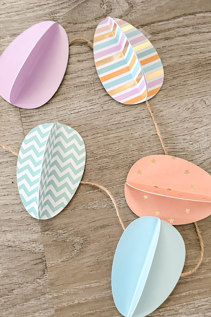 paper easter eggs in coordinating colors on twine