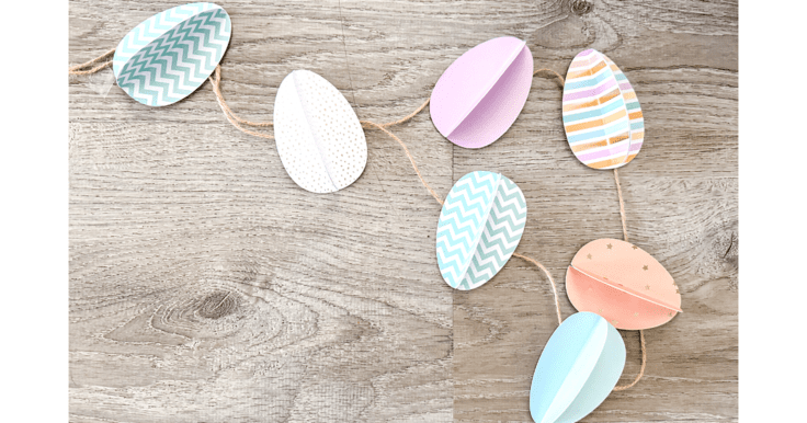 paper eggs garland laying on the floor