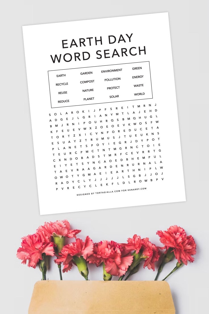 Preview of earth day word search printable on a light grey background with red carnations coming out of kraft envelope at the bottom.