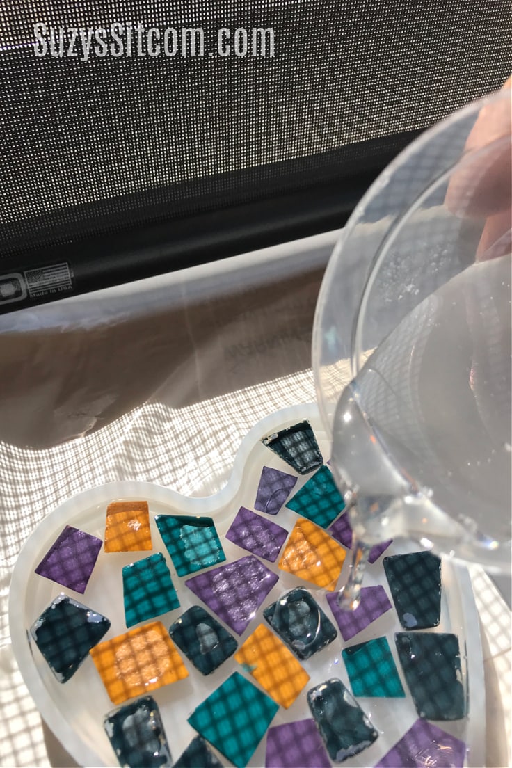 Adding glass tiles to resin and adding resin on top