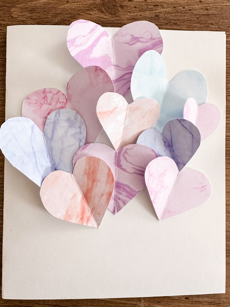 Multiple color hearts on a white card 