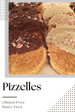 Pizzelles on a plate, right side dipped in white chocolate, left side dipped in milk chocolate with peppermint sprinkles