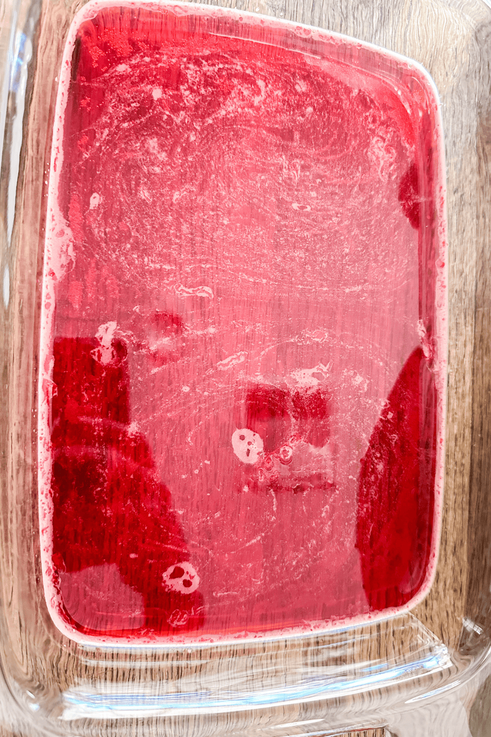 red jello in a glass tray