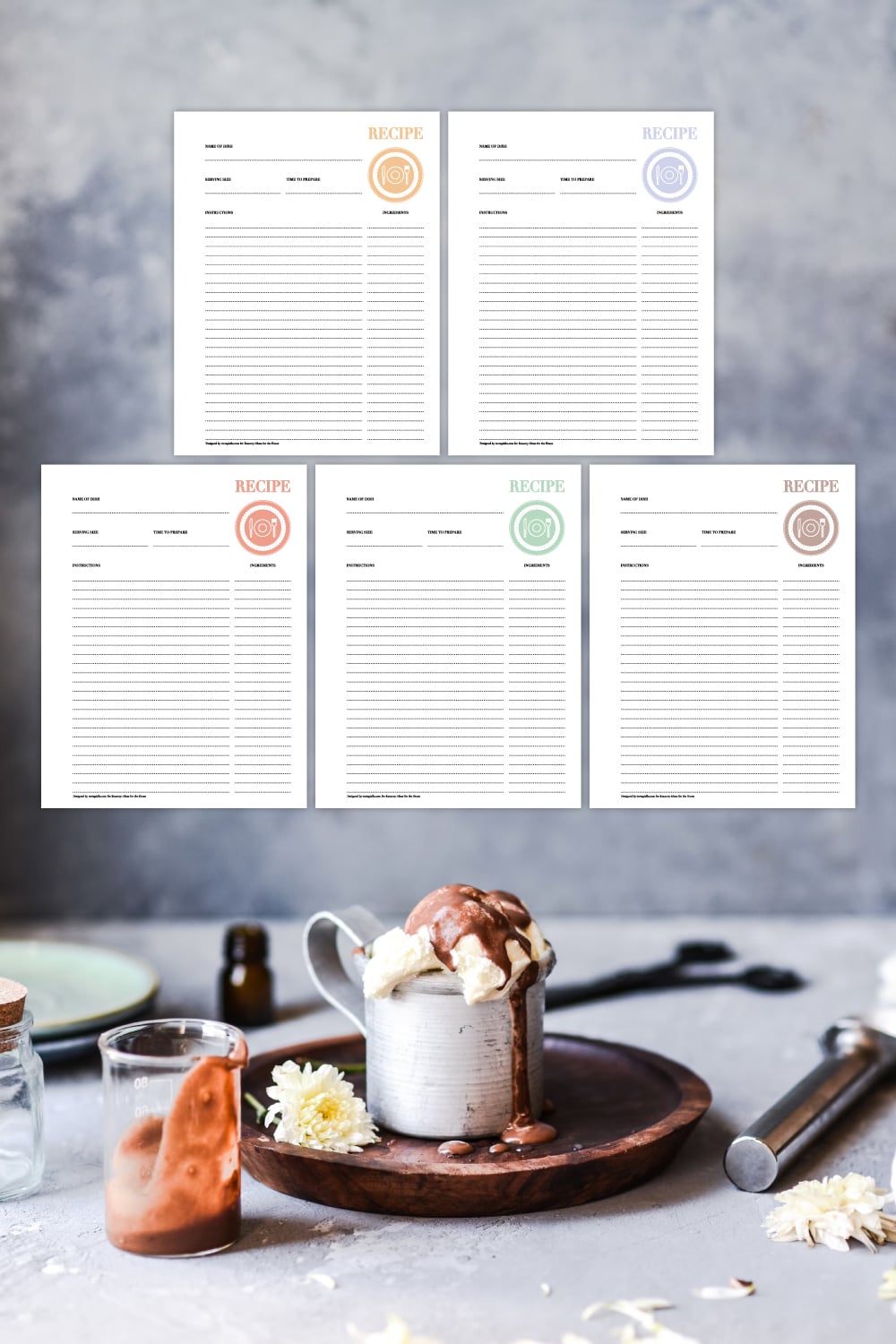 Preview of recipe template page in five colors above grey kitchen countertop image with dessert in mug and tools in view on the bottom.