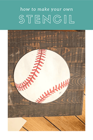 A print out of a baseball sitting on a piece of wood